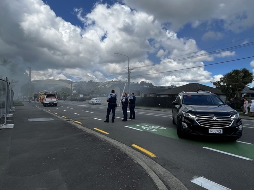 Fire crews and police on the scene of a house fire in St Martins, Christchurch. Photo / Sam Hoeflich