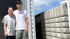 Thomas Cho and wife Sol Yun say they can't fit a big gas bottle for cooking at their West Auckland property because the point of access was poorly designed.