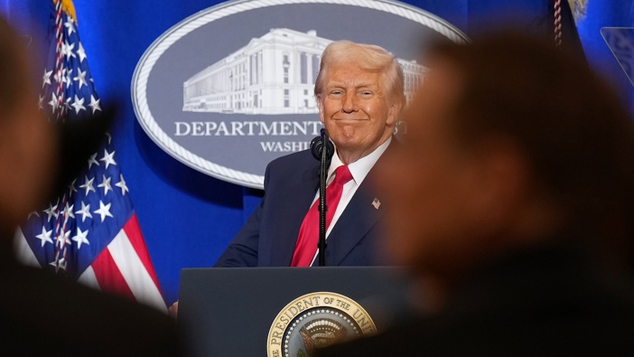 U.S. President Donald Trump reacts while speaking at the Justice Department March 14, 2025 in Washington, DC. (Photo by Andrew Harnik/Getty Images)