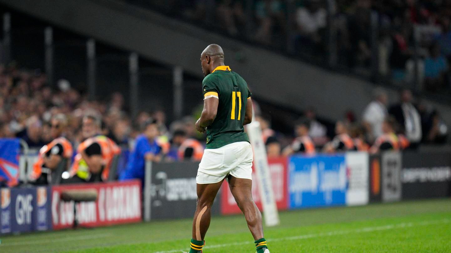 South Africa's Makazole Mapimpi leaves the field after a head clash against Tonga. Photo / AP