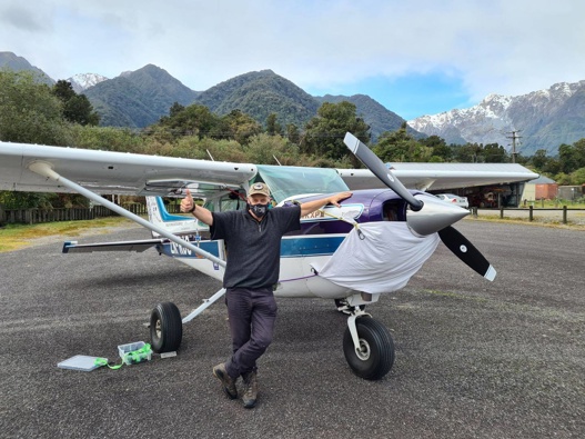 Dr Dave Baldiwn, aka The Flying Doctor, with his masked Cessna ZK-Really Jolly Good. Photo / Supplied