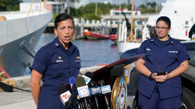 US Coast Guard Captain Jo-Ann F Burdian details the search of 38 missing migrants at a news conference. Photo / AP