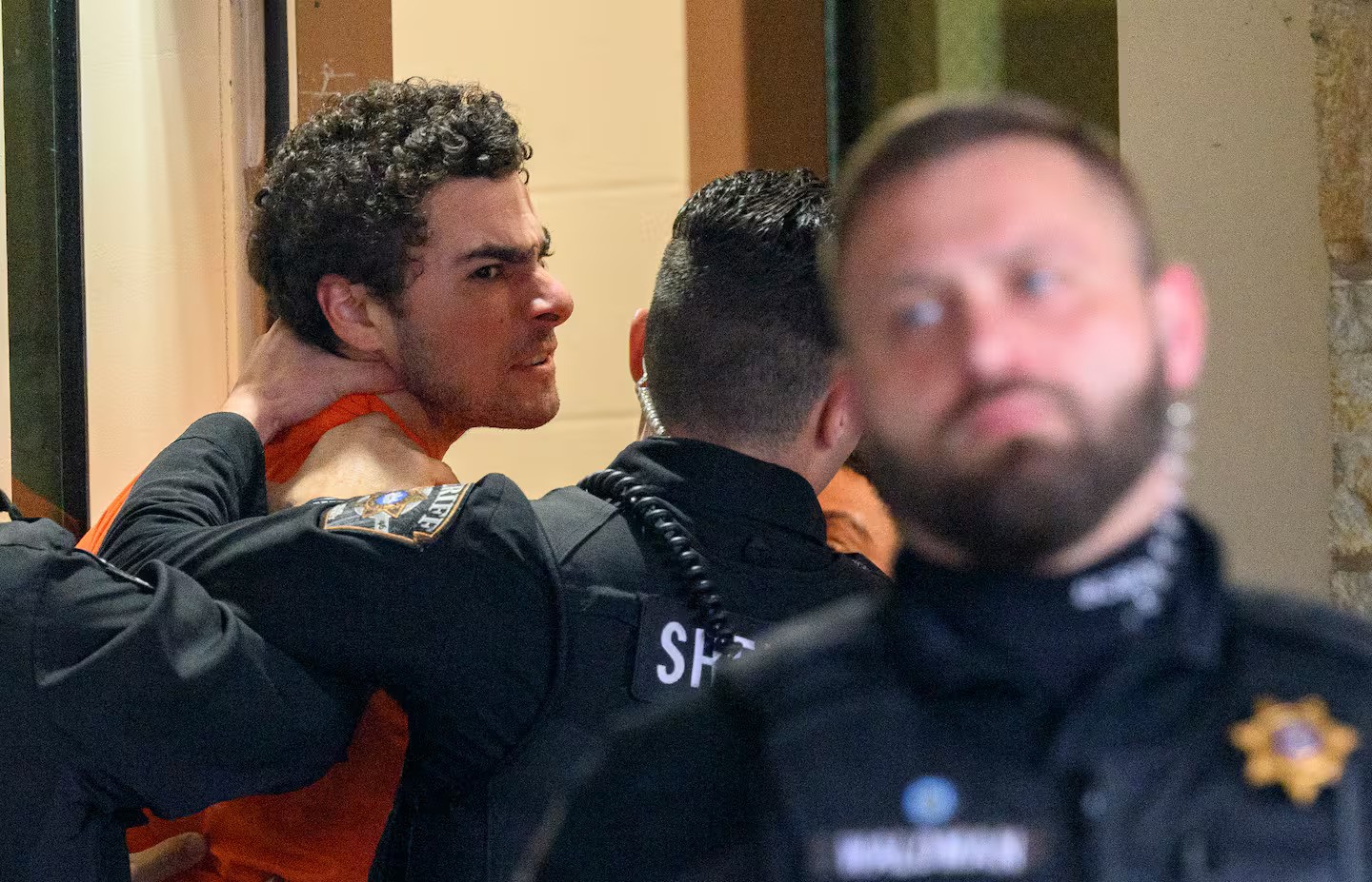Suspected shooter Luigi Mangione is led into the Blair County Courthouse for an extradition hearing. Photo / Getty Images