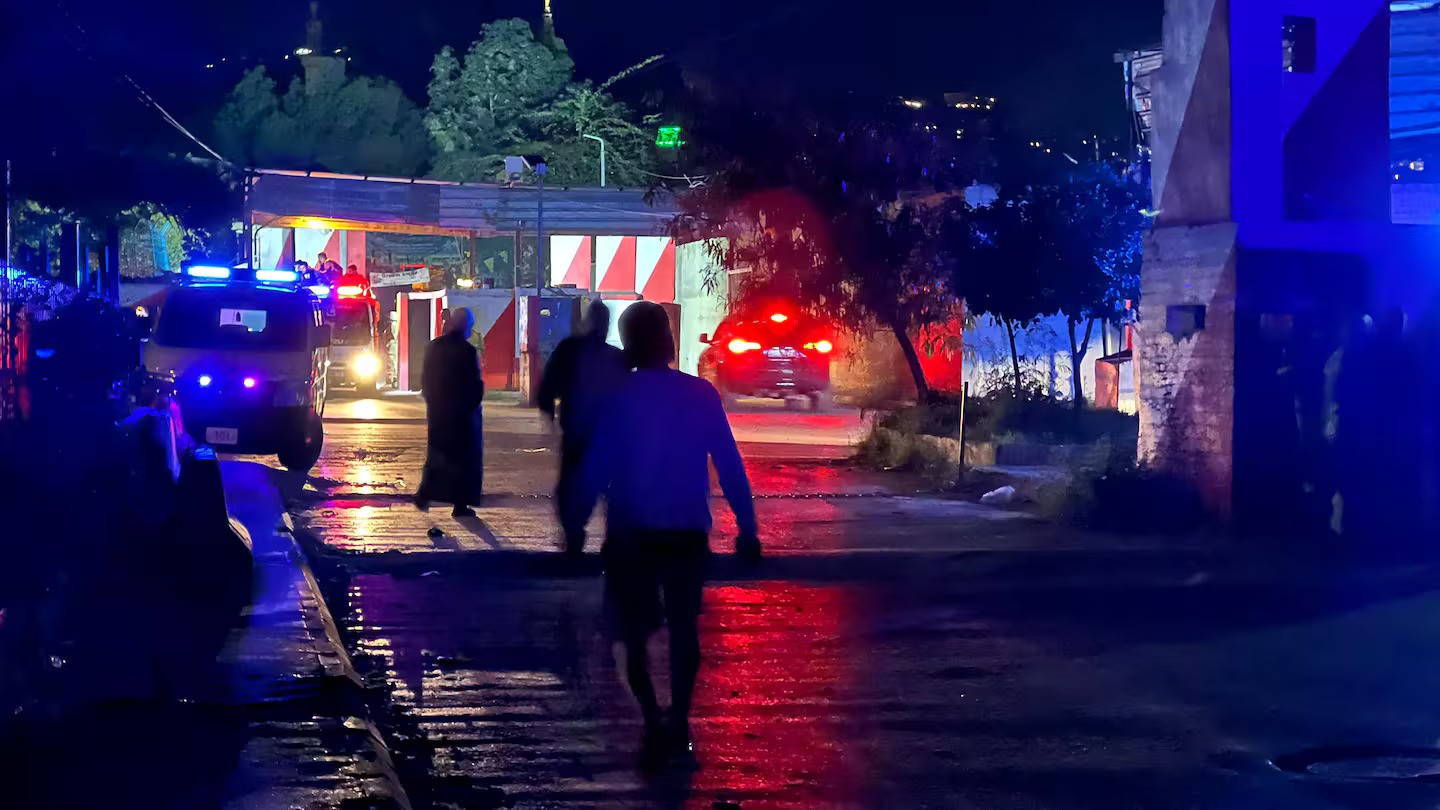 Ambulances rush to the site of an Israeli drone attack that targeted the Palestinian refugees camp of Ain al-Helweh near the southern Lebanese city of Sidon. Lebanon said an Israeli strike killed at least 13 people, as Israel said it struck a Hamas compound. (Photo by Mahmoud Zayyat, AFP