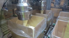 Hot cream cheese being packed at Fonterra's Darfield plant for Asian markets. Photo / RNZ, Cosmo Kentish-Barnes
