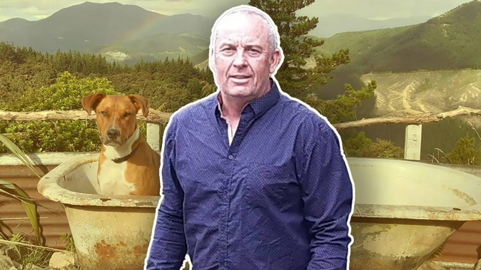 Kendall Smart with dog Gumboot at his hilltop property in north Nelson. Smart applied for a restraining order against his neighbour after a dispute over the shared access to their properties. A judge granted the order and also issued one against Smart. Photo / NZME