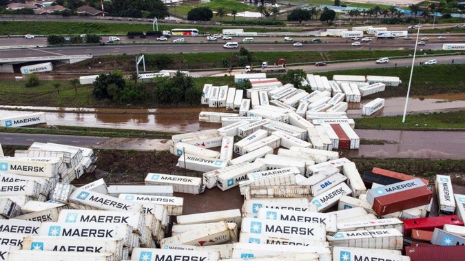 Shipping containers are strewn beside the N2 Highway in Durban, South Africa. (Photo / AP)