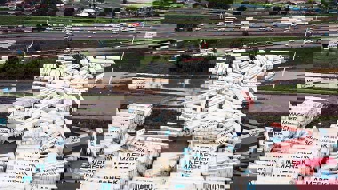 Shipping containers are strewn beside the N2 Highway in Durban, South Africa. (Photo / AP)