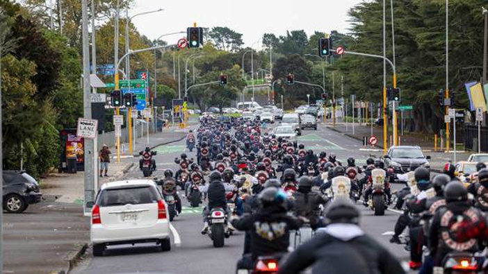 Smoke from motorcycle burnouts filled the streets around the farewell of Head Hunters gang member. Photo / Hayden Woodward