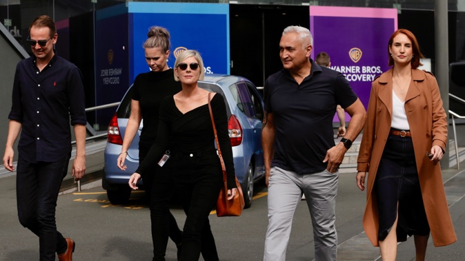Mike McRoberts and Samantha Hayes walk out of the Warner Brothers Mediaworks building in Eden Terrace, Auckland. Photo / Alex Burton