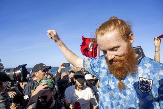 British runner Russ Cook celebrates with supporters after arriving to the finish line in Ras Angela, the most northern point of the African continent in Tunis, Tunisia. Photo / AP