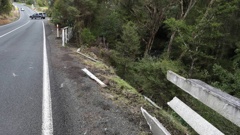 The driver of a Subaru Impreza crashed through this wooden fence along Whareora Rd, near entrance to A H Reed Memorial Park. Photo / Michael Cunningham