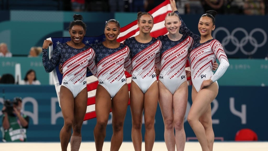 Simone Biles, Jordan Chiles, Hezly Rivera, Jade Carey and Sunisa Lee of Team United States celebrate after winning the gold medals during the Artistic Gymnastics Women's Team Final on day four of the Olympic Games. Photo / Getty Images