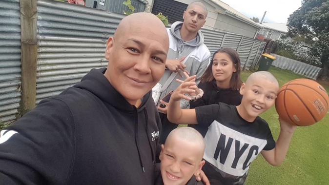 Mum of four Patricia Wilson - also known as Tira - with her four children. (Photo / Supplied)