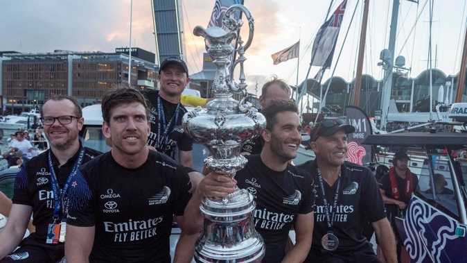 Team New Zealand celebrate with the America's Cup after defeating Luna Rossa. (Photo / Chris Cameron)