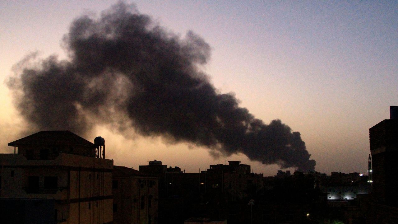Smoke rises above buildings in southern Khartoum on May 19, 2023, as violence between two rival Sudanese generals continues.