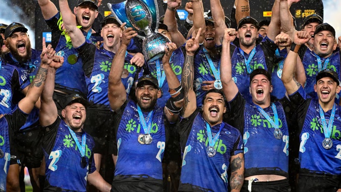 Patrick Tuipulotu lifts the Super Rugby Pacific trophy. Photo / Photosport