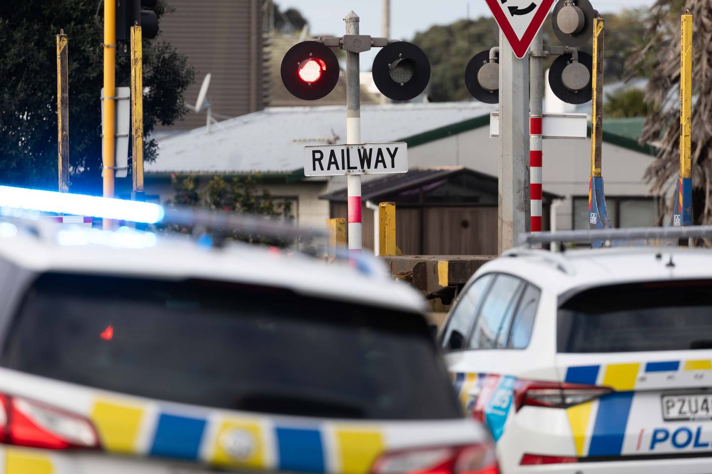 Police at the scene of the incident at the Hewletts Rd railway crossing on Monday. Photo / Alex Cairns