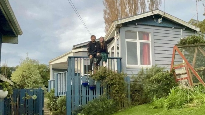 Stacey Kirby and his partner at the home they bought in April, and finally moved into four months later after the previous owner was forcibly removed.