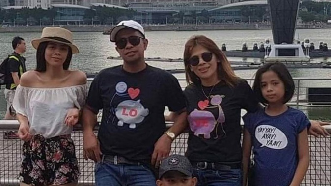 Carpenter Jay Abellano (second from left) has been waiting two years for news about his visa application, and dreams of being reunited with his family. Photo / Supplied