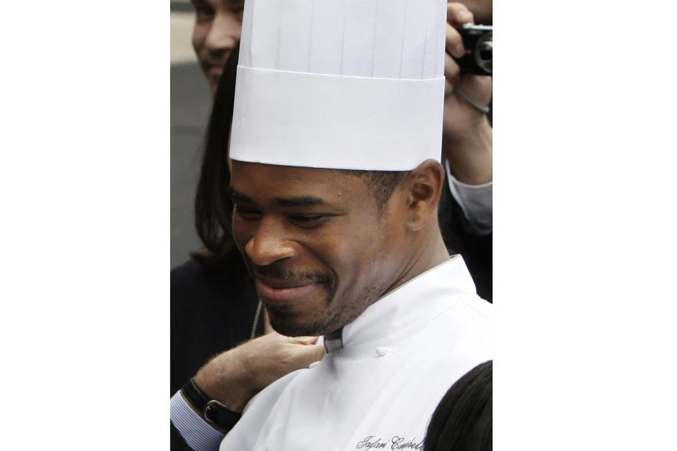 White House Chef Tafari Campbell smiles Nov. 6, 2008, on the South Lawn of the White House in Washington. Campbell, an employee of former President Barack Obama, has drowned near the couple’s home on Martha’s Vineyard. Massachusetts State Police confirmed that the paddleboarder whose body was recovered from Edgartown Great Pond on Monday, July 24, 2023 was Tafari Campbell, of Dumfries, Virginia. (AP Photo/Ron Edmonds, file)