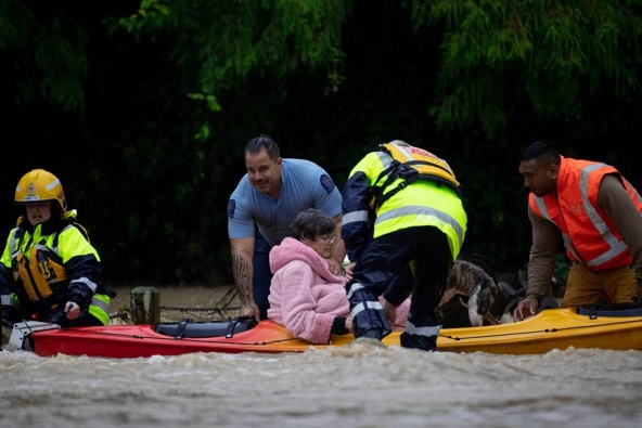 Residents rescued from Ranui's Urlich Drive. Photo / Hayden Woodward