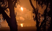 This handout photo taken and released by Giuliana Elakis on April 16, 2026 shows a fire at the Viva Oil Refinery in Geelong. Emergency crews were responding early on April 16 to a fire raging out of control at one of Australia's two remaining oil refineries which supplies 10 percent of the country's fuel. (Photo by Handout / Giuliana Elakis / AFP)