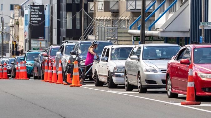 The Taranaki St testing site was particularly busy this afternoon with a line of cars stretching down the road. Photo / Mark Mitchell