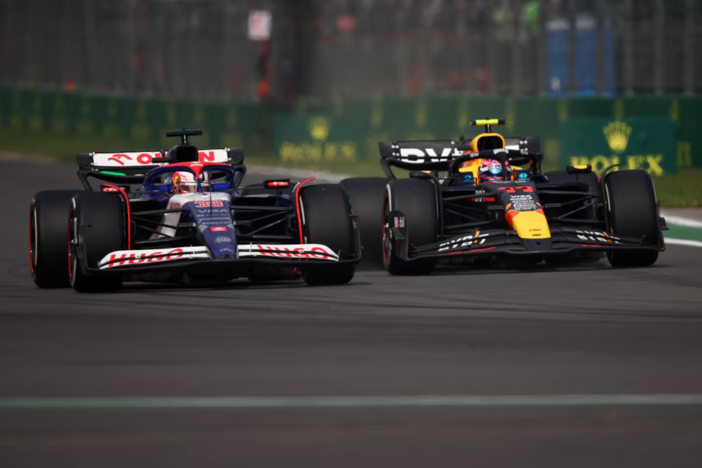 Liam Lawson and Sergio Perez went wheel-to-wheel at the Mexican Grand Prix. Photo / Getty Images