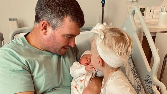 Ryan Fox with newborn Margot and his eldest child Isobel. Photo / Instagram