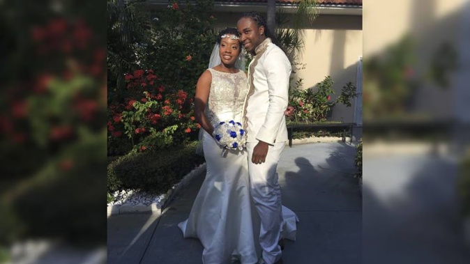 Jean-Dickens Toussaint and his wife Abigail Michael Toussaint pose for a photo at their wedding in Pompano Beach, Florida. Photo / AP