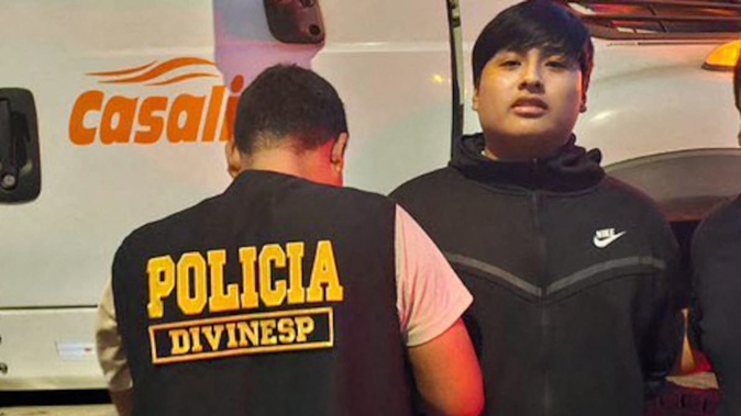Peruvian police officers arrested "little J" in Pucusana, Peru. He is considered the mastermind behind a brutal triple murder of women that authorities suspect is linked to drug trafficking in Argentina. Photo / AFP, Peru's National Police, Handout