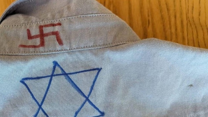 A child's school shirt marked with the Star of David and a swastika. The Holocaust Centre of New Zealand says antisemitism is on the rise in New Zealand schools since the Hamas-led terrorist attack on southern Israel in October.