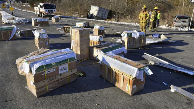 Crates holding live monkeys are scattered across the westbound lanes of state Route 54 at the junction with Interstate 80 near Danville. Photo / AP
