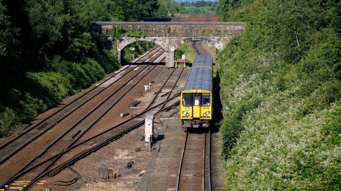 A train pulls into Hunts Cross Station, in Liverpool, England, Monday, June 20, 2022. (Photo / AP)
