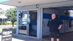 Autoworld Papamoa owner Grant Robertson wants the Tauranga City Council to increase on-street parking rather than issue customers fines for unwarranted and unlicensed vehicles. Photo / Sandra Conchie