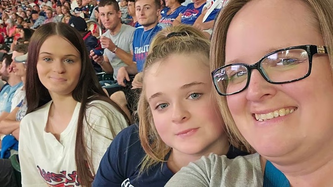 Abby, Isabella and mother Sonya Turner at an Atlanta Braves game in 2023.