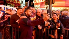 Adam Reynolds of the Brisbane Broncos takes a selfie with fans during the NRL season launch at Fremont Street Experience in Las Vegas, Nevada. Photo / Getty
