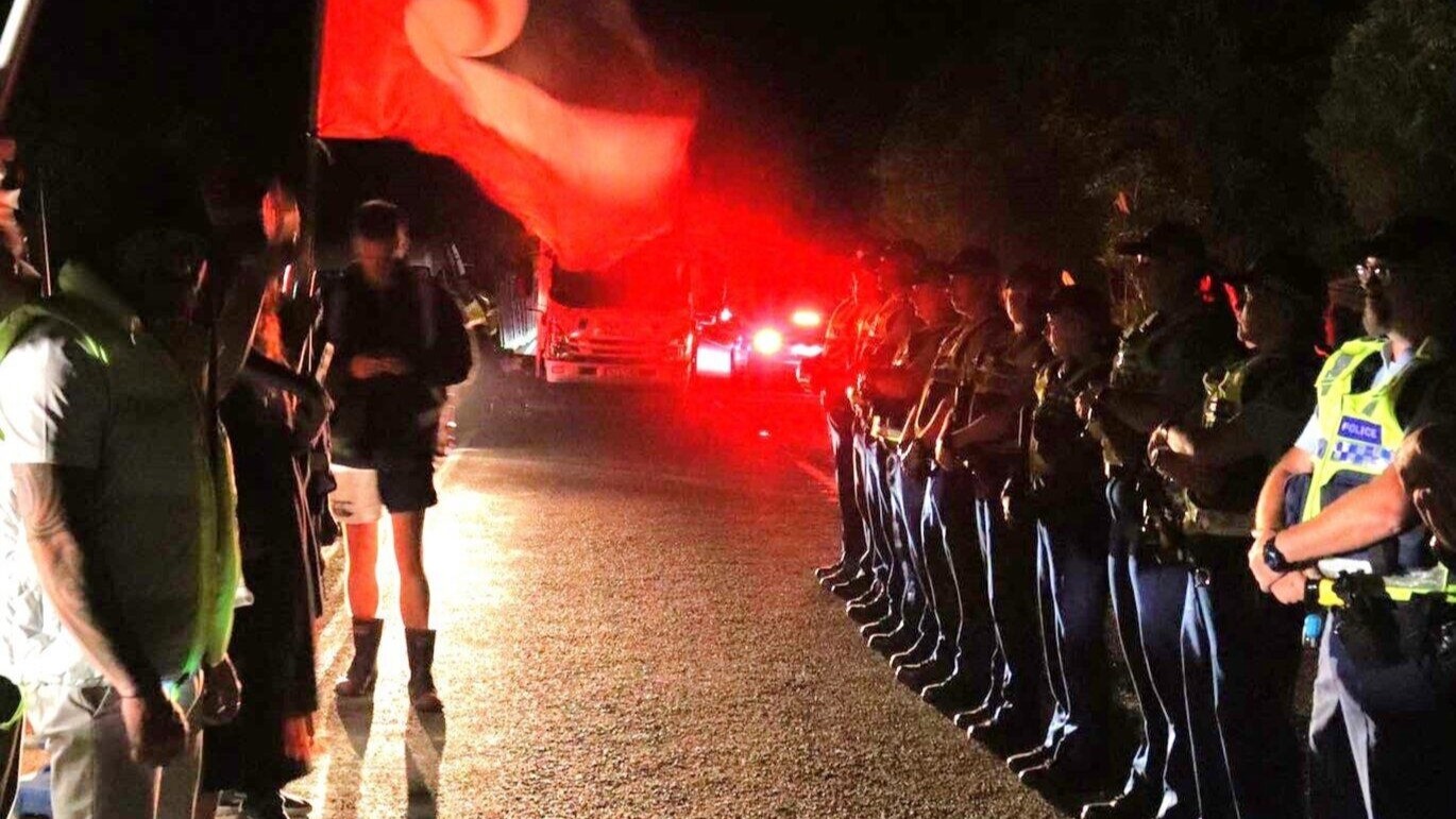 Protestors and police face off at the work site at Lake Rotokakahi where a controversial pipeline resumed overnight. Photo / Protect Rotokakahi