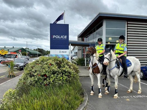 Senior Constable Borrell and Detective Constable Andrews with trusty steeds Chief and Ruby. Photo / NZ Police