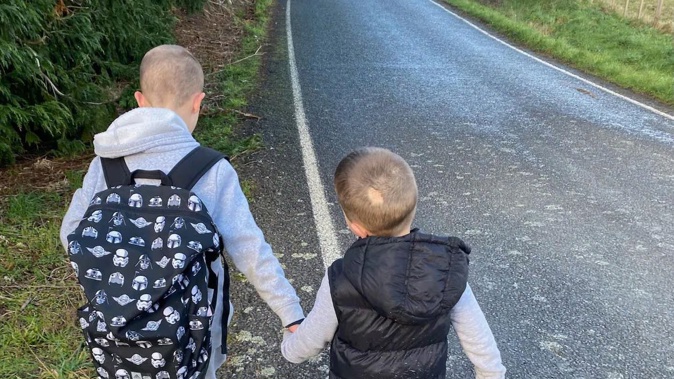 The son who died (right) was the 'best baby brother ever' said his sibling (left).