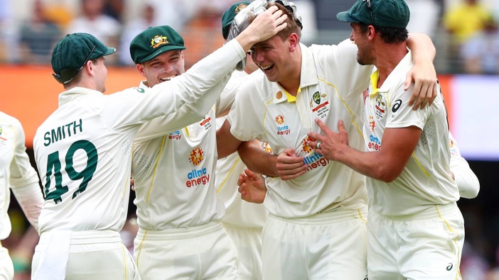 Australia's Cameron Green, second right, is congratulated by teammates after taking the wicket of England's Ollie Pope during day one of the first Ashes test. (Photo / AP)