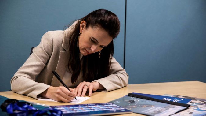 Prime Minister Jacinda Ardern writes a note the future prime minister who will host Apec at a future date - maybe 20 years away. (Photo / Supplied)
