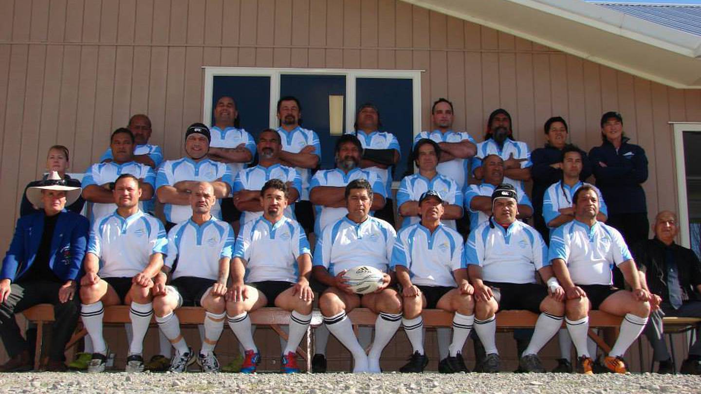East Coast rugby legend Morgan Waitoa, pictured in the front row holding ball, has tragically died after a diving incident off the Te Araroa coastline. Photo / Neil Reid