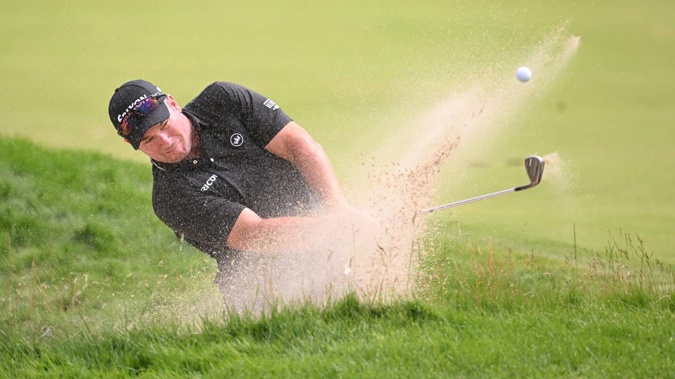 Ryan Fox plays a shot from a bunker. Photo / Getty