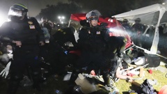 Police advance on pro-Palestinian demonstrators in an encampment on the UCLA campus Thursday, May 2, 2024, in Los Angeles. (AP Photo/Jae C. Hong)
