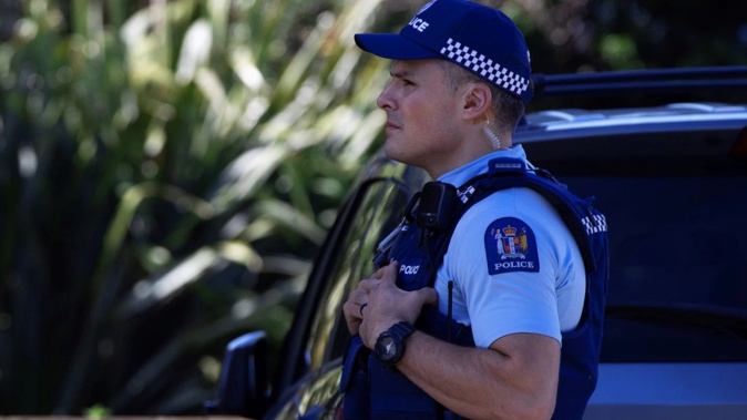 A property was cordoned off after a body was found inside a vehicle that had been brought to a police station. Photo / Hayden Woodward