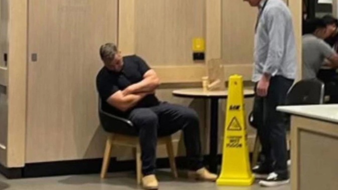 Anthony Seibold having a snooze at Maccas. Photo / news.com.au