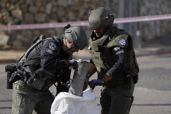 Police remove the remains of an intercepted rocket fired from Lebanon in Shlomi, northern Israel Thursday, April 6, 2023. Israeli air defenses intercepted a rocket fired from Lebanon into northern Israel, the Israeli military said. It was not immediately clear who was behind the rare rocket fire from Lebanon. Photo / AP