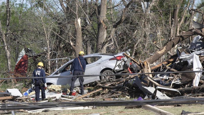 Wichita firefighters search what's left of John's Animal World on Saturday, April 30, 2022 in Andover, Kansas. Photo / AP
